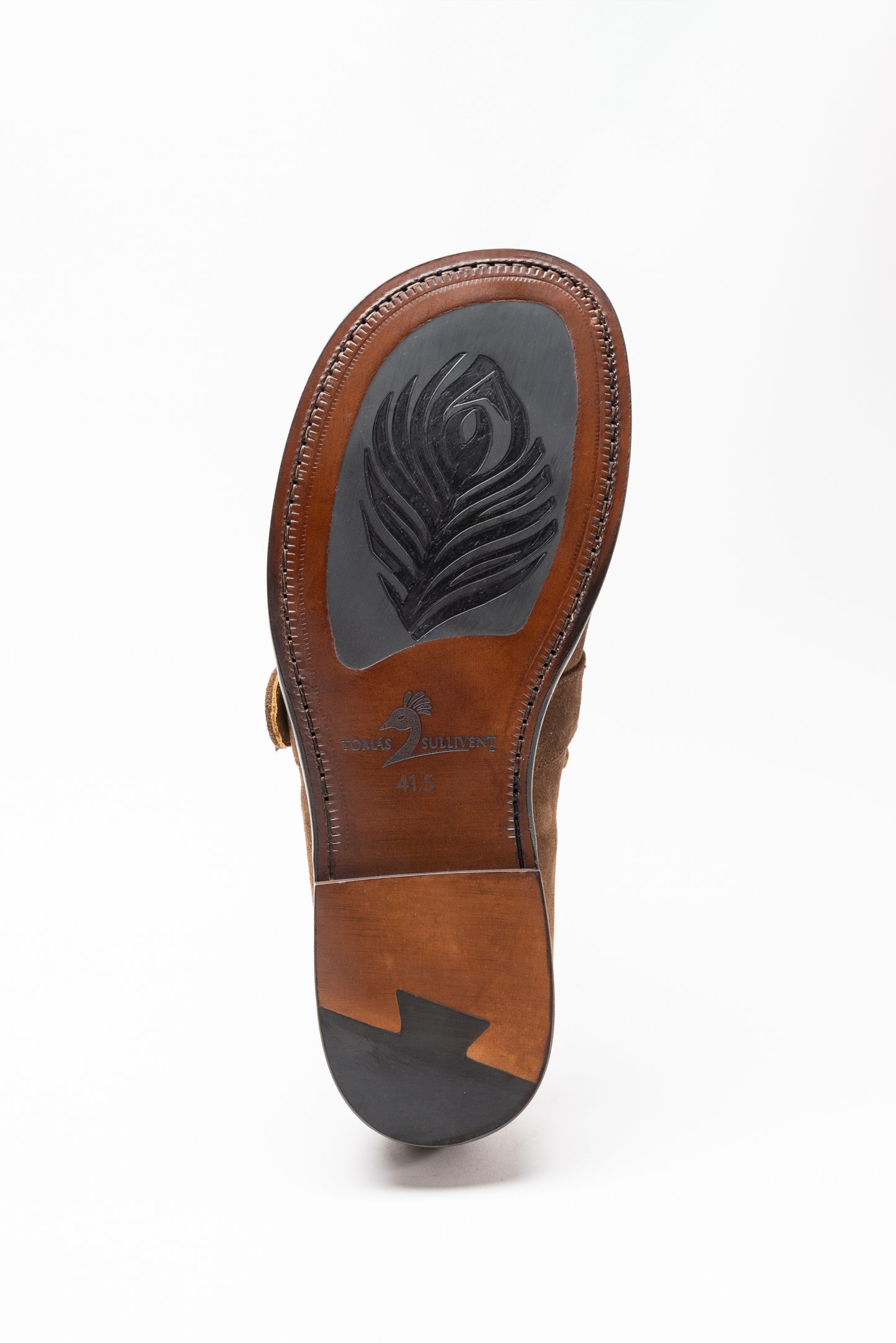 Brown sandal sole with brand logo on a white background