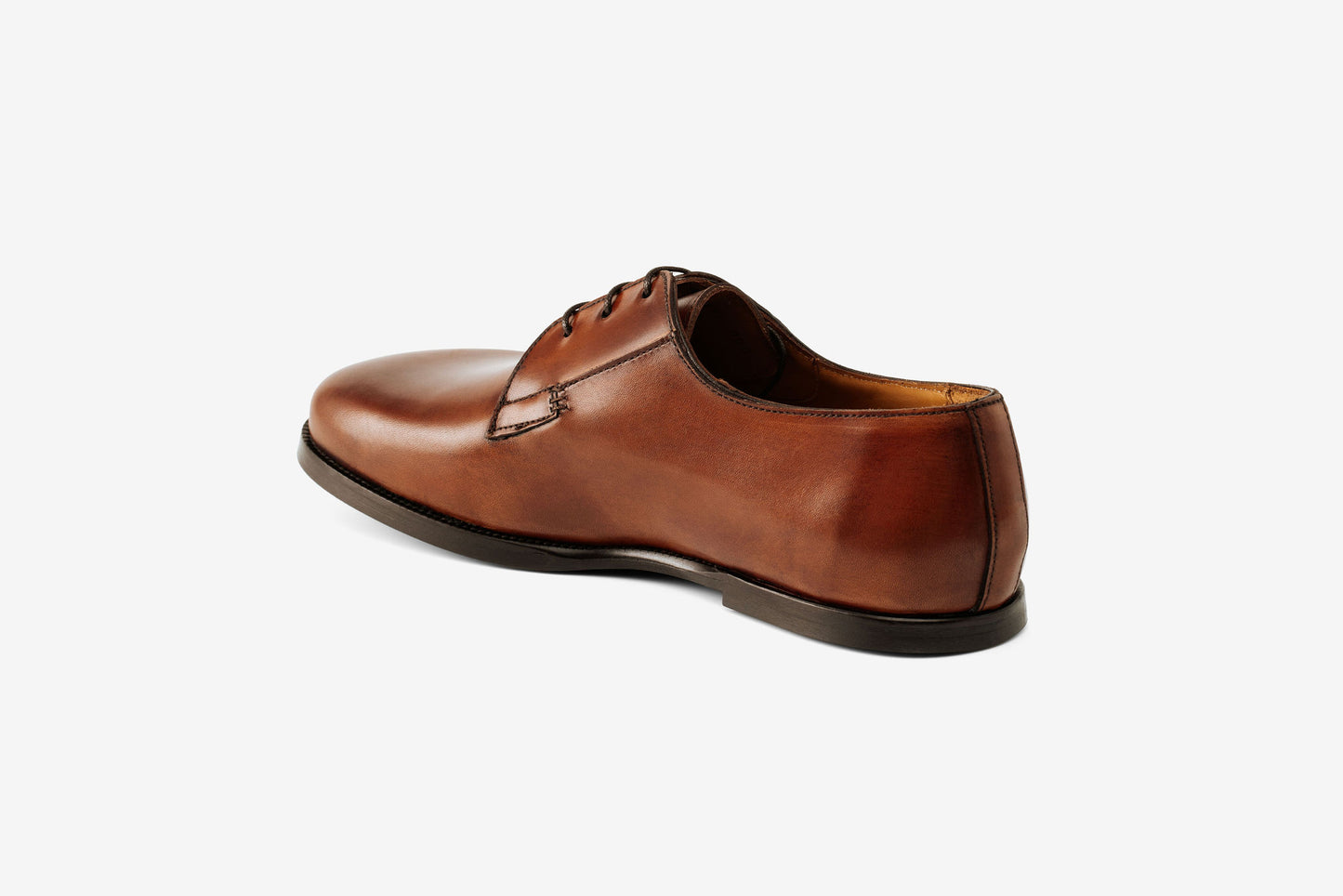 A brown leather men's lace-up shoe with a round toe and a flat sole.